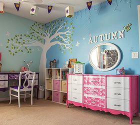 makeover to a princess room, This is the corner of the room you can see the Rapunzel flags and a few lanterns hung from the sealing A White tree was painted in the corner with two tone walls to make it light and fun