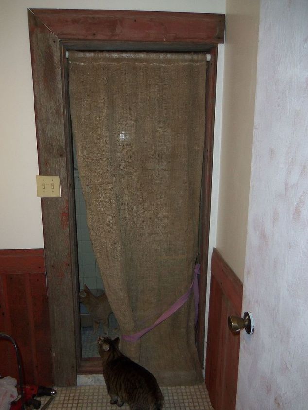 q this bathroom needs help on a budget help me friends, bathroom ideas, home decor, home improvement, home maintenance repairs, painting, You like burlap You want rustic You can t sew I give you Hot Glue litter box curtain Still needs trim at top where glue shows 3 13 14