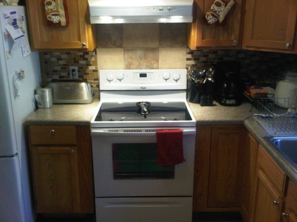 q our duplex remodel in amp out, doors, home decor, kitchen backsplash, kitchen design, tiling, Finally a new cooktop stove