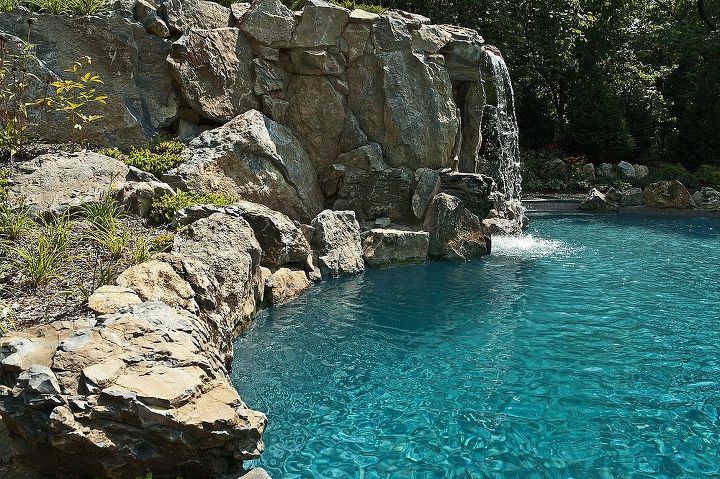 some of our best projects are a result of a referral from some one who did not use us, concrete masonry, outdoor living, pool designs, spas, View of the grotto waterfall from the pool pavilion