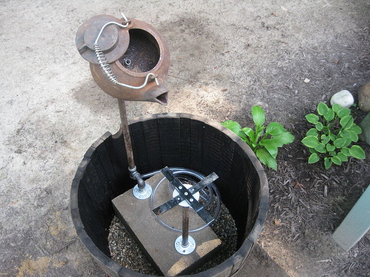 tea pot fountain instructions, We then built a support for the gold pan and dropped the unit into the whiskey barrel We added a fountain pump and inserted tubing up through the tee on the bottom of the pipe that supports the tea pot and into the tea pot