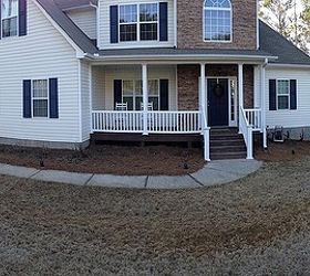 what to do with front yard pine beds simple and affordable, flowers, gardening, landscape, Rain collects here and gets mushy Thinking river rock But not sure how to design it
