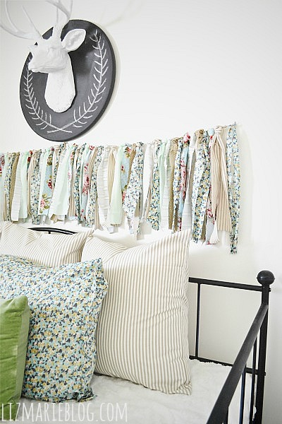 diy fabric garland, crafts, The DIY fabric garland hangs above our day bed in the guest bedroom