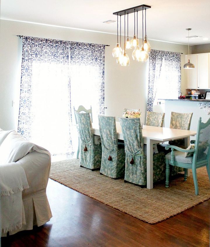 a brightened up dining area, home decor, shabby chic, A large rug anchors the area and designates a single space