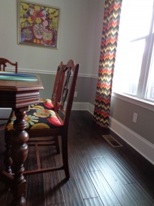 in living color, painted furniture, Dark wood floors and grey walls with chair rail for contrast
