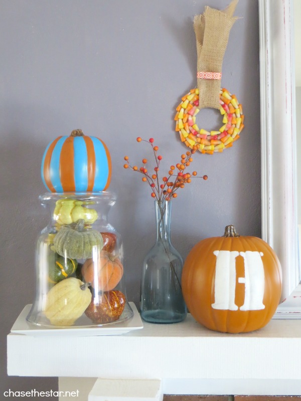teal and orange fall mantel, seasonal holiday decor, Gourds glass and candy corn complete this vignette