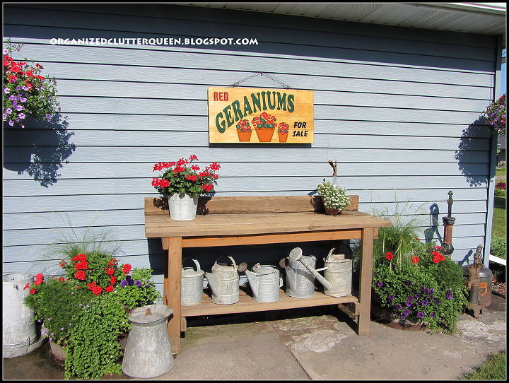 my potting bench watering can collection amp pumps, electrical, gardening, outdoor furniture, painted furniture, rustic furniture, This is the Menard s work bench kit that became my potting bench with my watering can collection