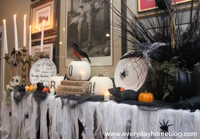 my creepy well not really halloween mantel, halloween decorations, seasonal holiday d cor, Handmade Dollar Store plates using a black sharpie are one of the many projects I created for this mantel