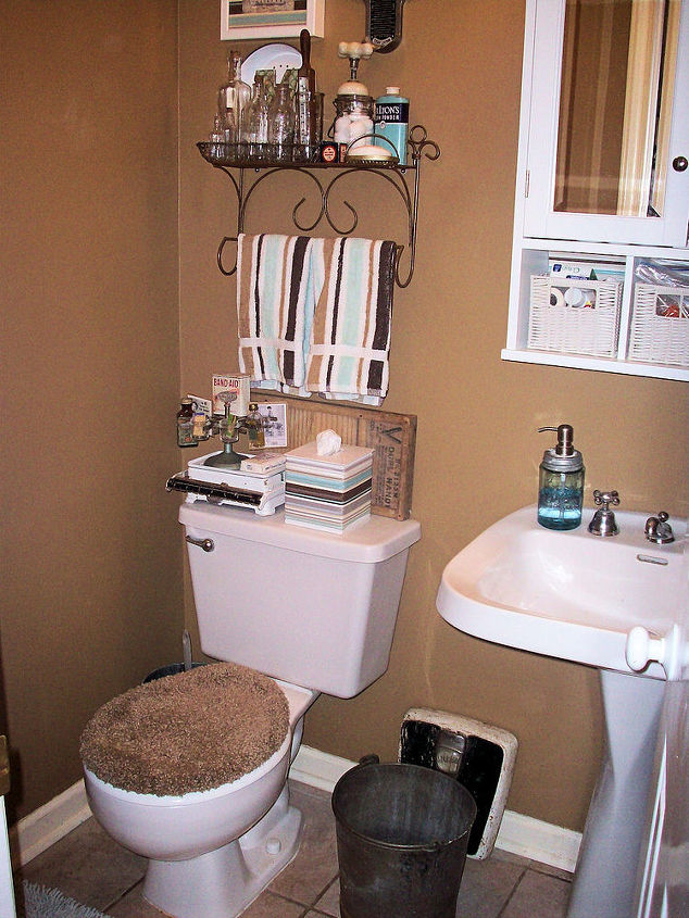 vintage powder room always a work in progress, bathroom ideas, home decor, What started this room off was the vintage floor scale from a yard sale A well bucket works as a trash can And a re purposed Ball jar soap dispenser kits can be found at