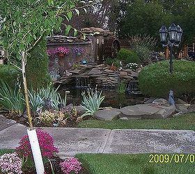 landscaping, outdoor living, ponds water features, This photo was taken just as evening was coming on I m not a photographer but this turned out really great I entered the picture at the fair but a cat took 1st and a skyscraper took 2nd oh well