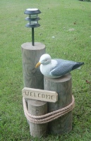 seagull on wood piling lawn ornament