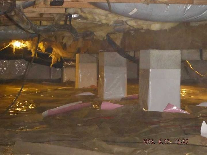 encapsulating a crawl space with many concrete piers, Beginning to wrap the pillars with the CleanSpace Crawl Space Liner
