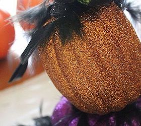 how to make topsy turvy glam pumpkins, crafts, seasonal holiday decor, Snip off a few feathers and hot glue them randomly between the pumpkin layers This will hide the little wooden nub from the skewer