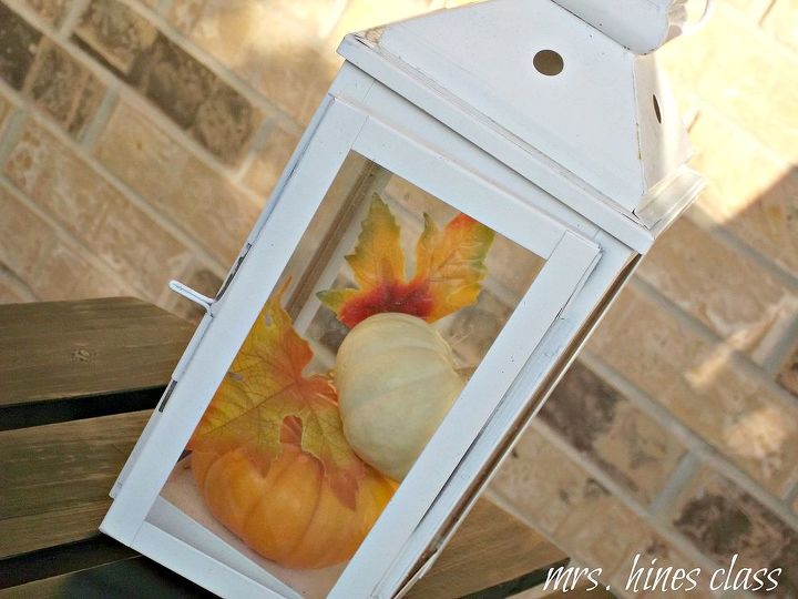 decorating the front porch for fall, home decor, seasonal holiday decor, The lantern houses a couple more mini pumpkins