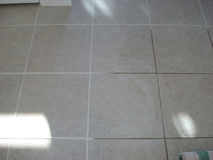 sealer to get tile floor and wall grout clean, bathroom ideas, home maintenance repairs, tile flooring, tiling, Half the floor done with Grout Shield color seal