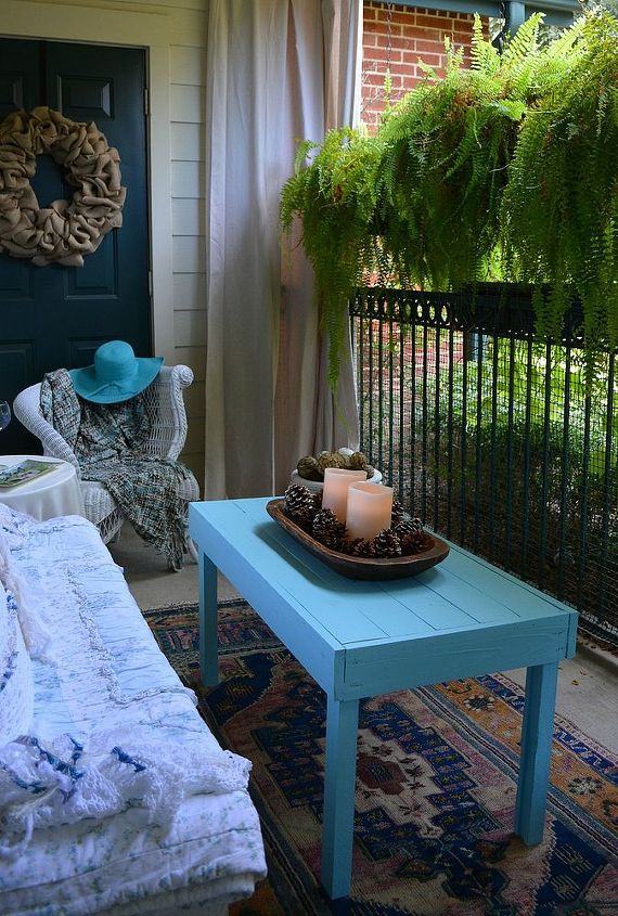 my new shabby chic porch from some discarded items, curb appeal, home decor, painted furniture, shabby chic, My husband made this cocktail table and we painted it turquoise blue