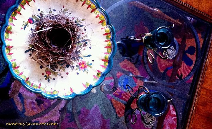 creating eclectic which is kind of coocoo style tips and ideas, home decor, A birds nest is the perfect juxtaposition to the hand painted plate I brought home from Italy The glass top coffee table provides the perfect view to my colorful rug