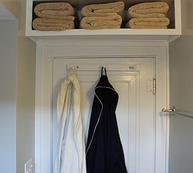 tips for decorating a small space, home decor, Look up for more storage We built this shelf over our bathroom door for our extra towels It was really easy