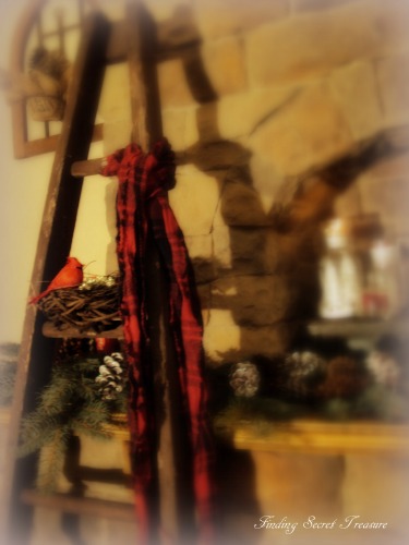 cozy winter mantel, seasonal holiday d cor, A little vintage red bird and nest on an old ladder cozyed up with a winter scarf