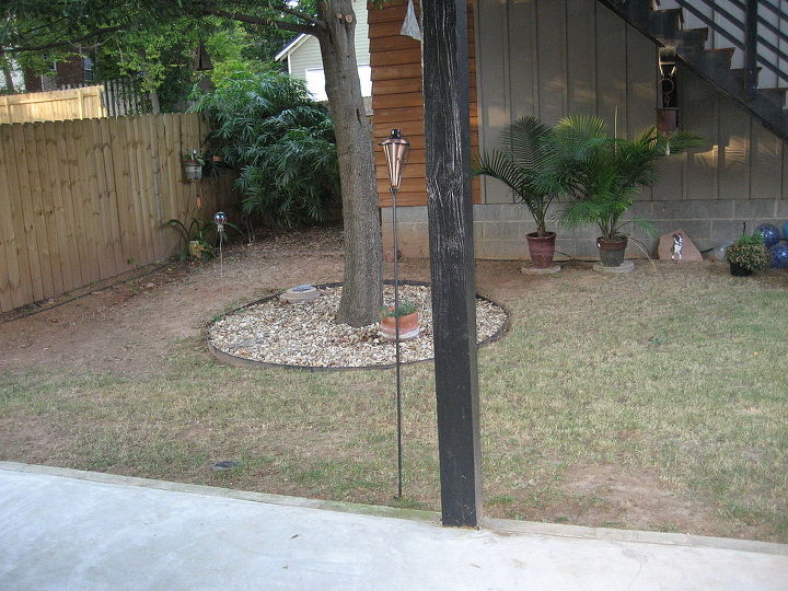 backyard koi pond, This i a view of the pond location from the side of the yard The edge of the garage foot print is visible as if the scope of the oak tree