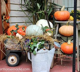outdoor decorating for fall, porches, seasonal holiday decor, An Galvanized Water Can is filled with Fall Pansies