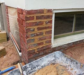repointing brick a porch foundation repair, concrete masonry, curb appeal, home maintenance repairs, how to, Using my mortar pan trough and setting it under where I was working I loaded up the back side of a large mason s trowel I took a tuck pointer and I worked to fill up the cavity in my brick fully