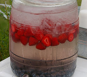sweet summertime front porch, curb appeal, outdoor living, porches, Simple summer beverage water flavored with strawberries and blueberries
