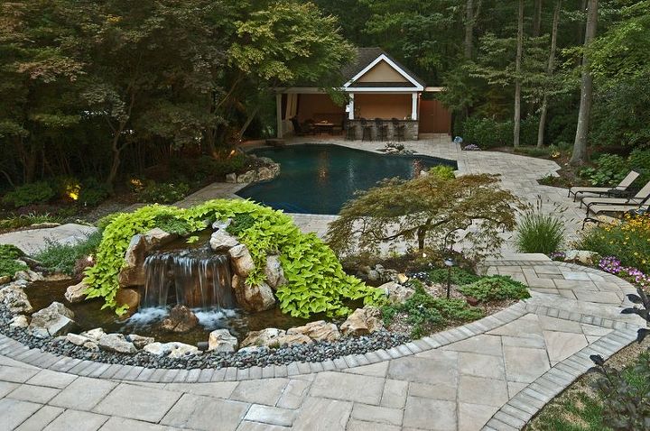 award winning backyard retreat includes portable spa, outdoor living, pool designs, spas, Backyard Waterfall We created upper patio waterfall to spill away from pool so it can be enjoyed from the house and upper patio including during the months when the pool area is closed down