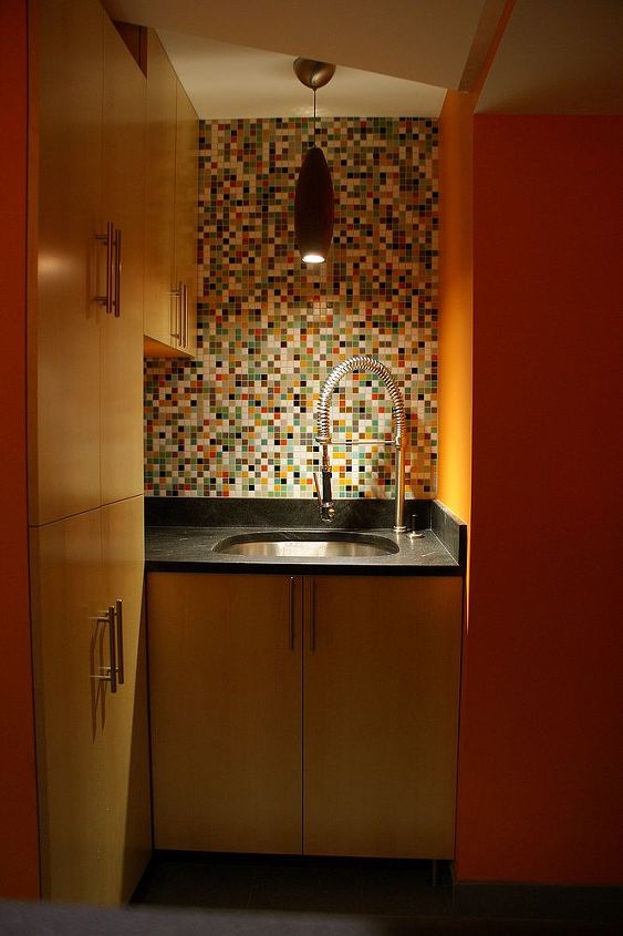 a functional laundry room, This laundry sink is not your mothers basement slop sink sitting on custom made maple vanity is a leathered piece of jet mist granite The faucet and sink are that of a commercial kitchen The oak pendant is from the local lighting store and I m not sure of it s origin The colorful mosaic is from modwalls