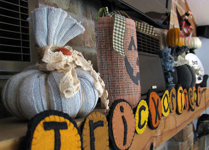 frugal fall decorating, crafts, flowers, repurposing upcycling, seasonal holiday decor, Sweater pumpkins made from old sweater sleeves and a paperback book pumpkin too