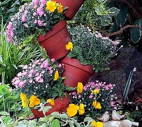 fall tipsy pots planter, gardening, Just updated the spring tipsy pots planter for fall by adding fall pansies small mums plectranthus and a little curry plant See more pictures at
