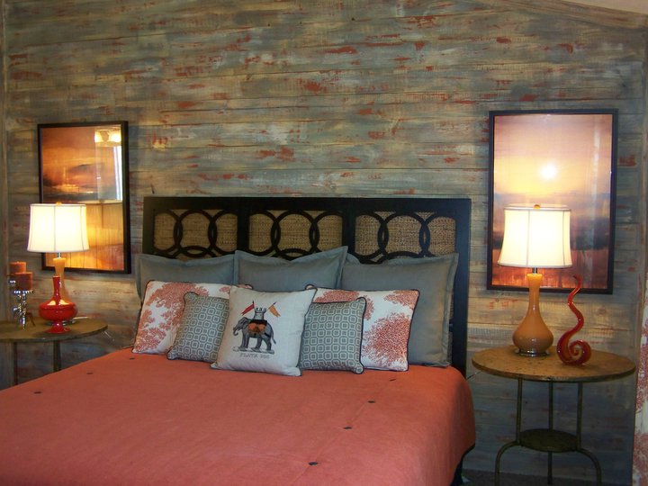 Atlanta designer Angela Hogan had raw wood applied to the bed wall and then I used a three step aging process to get a weathered look that also incorporated the dominant colors in the bedding. The builder was worried at first but loved it after all the painting and decor was in place. Beazer Homes/ Houston, TX