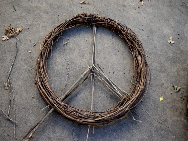 giant peace wreath made out of twigs, crafts, seasonal holiday decor, wreaths, I used twigs and grapevine wire to make the peace sign in the middle