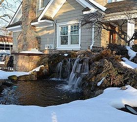 winter waterfall in the snow, outdoor living, patio, ponds water features, This is our display pond at waterfall at our Design Center Deck and Patio company runs this all winter long During hard freezes there is a lot of ice which lowers the water level in the pond