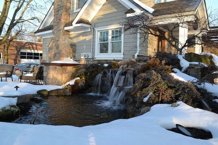 winter waterfall in the snow, outdoor living, patio, ponds water features, This is our display pond at waterfall at our Design Center Deck and Patio company runs this all winter long During hard freezes there is a lot of ice which lowers the water level in the pond