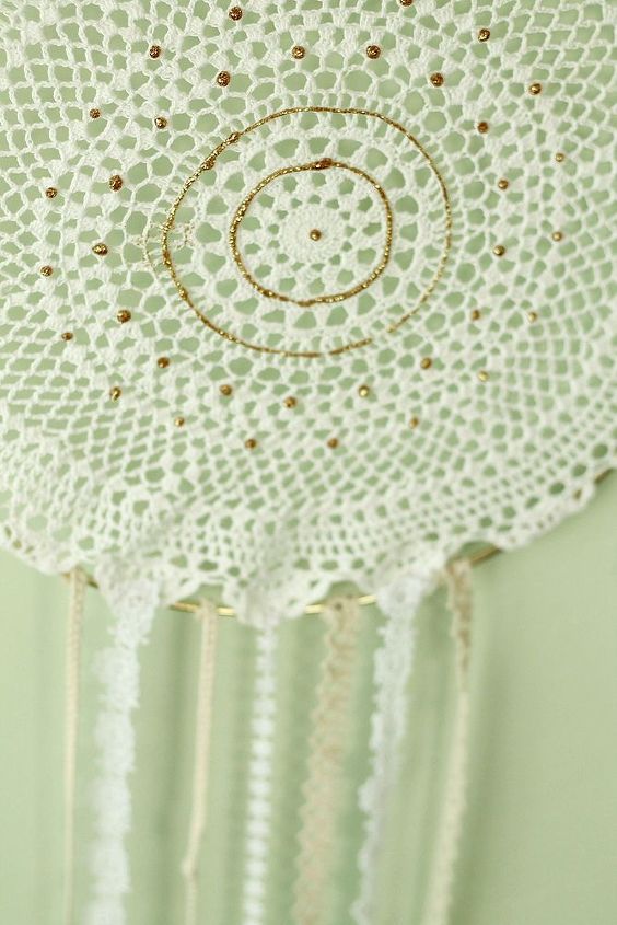 diy dreamcatcher, crafts, repurposing upcycling, A store bought doily is stretched around a gold hoop Glitter accents the design