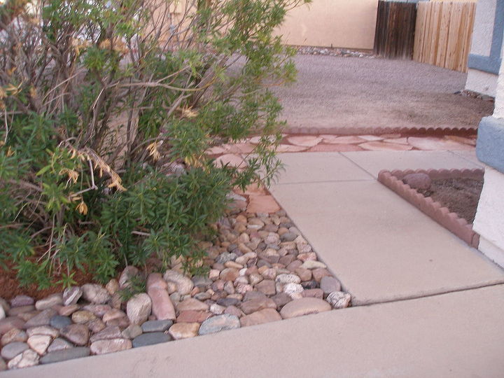sand stone walk way, Added more rocks to the low end of walk way next to driveway