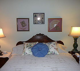 I wanted to accent the shape of my client's beautiful headboard with her special antique shadow boxes that were so dear