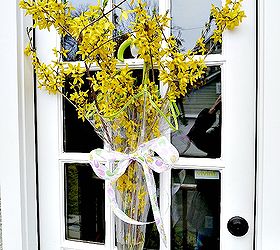 Think outside the wreath - how about a flower filled umbrella door!