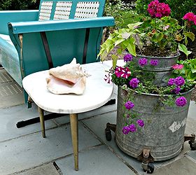 q mixing vintage amp mod to create a killer patio, gardening, outdoor living, patio, porches, Vintage porch glider mid century marble table old mop buckets Click link for more pics http eclecticallyvintage com 2012 06 my patio reveal