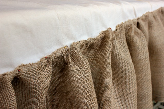 how to make a burlap bed skirt, bedroom ideas, crafts, home decor, I pinned the burlap ribbon to each end and to the middle of the existing bed skirt I pinched and pinned it all down Then I sewed it right on top of the bedskirt I used an entire roll for each side and half a roll for the end
