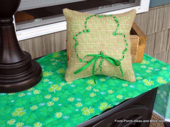 st patrick s day porch decor add a bit o green, outdoor living, porches, seasonal holiday decor, wreaths, Make a burlap shamrock pillow with our tutorial