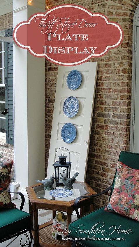 thrift store door plate display, outdoor living, porches, repurposing upcycling, The plates still had the plate hangers on them Simply hammer a nail in and done Easy cheap wall art