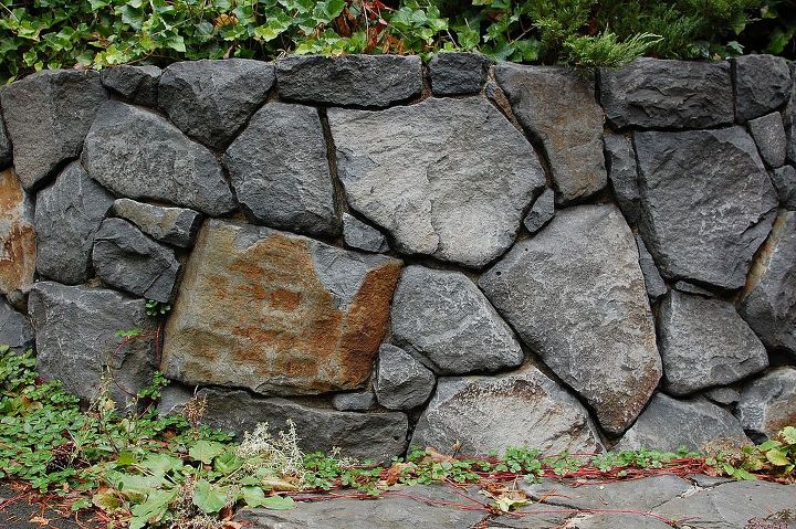 boulder retaining wall, concrete masonry, outdoor living, Ross NW Watergardens Portland Landscaper built this stone wall with basalt boulders