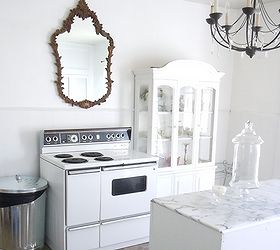 budget friendly kitchen makeover, home decor, kitchen design, kitchen island, The stove is my favorite part 1959 GE stove FREE from Craigslist The chandelier was 2 at a yard sale The mirror is an unconventional pop of contrast above the stove