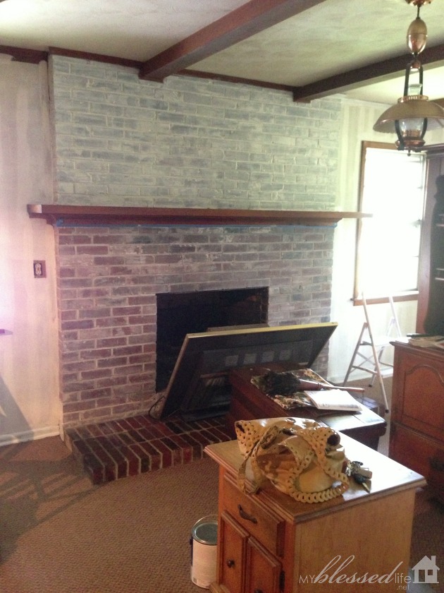 transform a brick fireplace with a white wash before after, concrete masonry, fireplaces mantels, painting, You can see one layer of 2 1 whitewash below the mantel and a second coat of 1 1 above the mantel