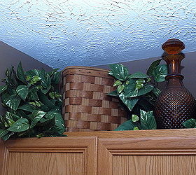 above cabinet decor, home decor, Baskets are common decor items found above the cabinet