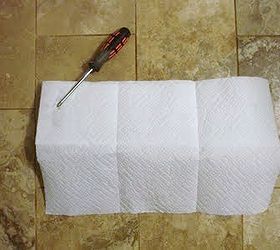 how to hang a wall object with two hooks, home maintenance repairs, I tore off a few sheets of paper towels the same length as my hook select a size paper towels work best Be sure to place the paper towels level with the top of your wall hook Then using my screwdriver I marked a spot on the paper towel for each hook