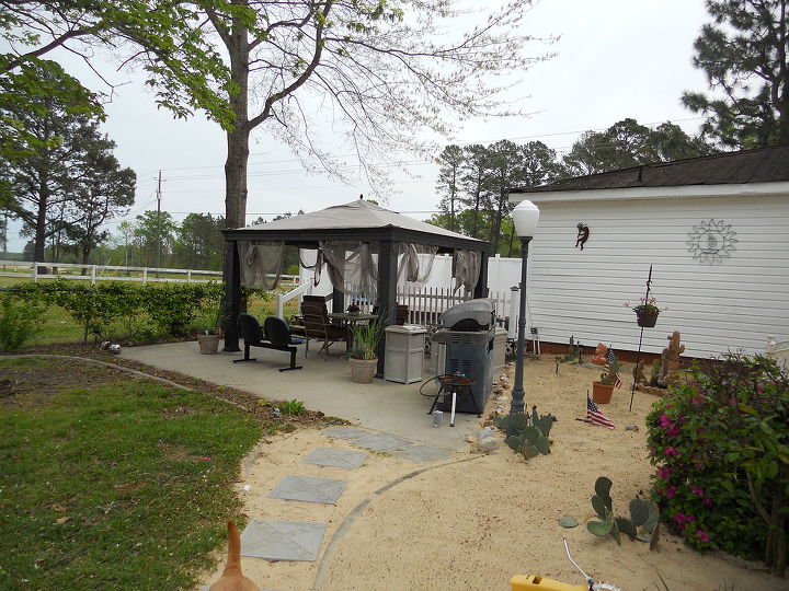 deck and patio, decks, doors, outdoor furniture, outdoor living, patio, The walkway that we put in is a simple one of sand and 16 blocks which separates the grassy area from my desert I ve loved this project I m sorry it took a hurricane to do this and hope we never have to do this again but we do look forward to spending a lot of time here this summer We had the deck area and the concrete area was poured but now it really pop with all of the new and reclaimed additions