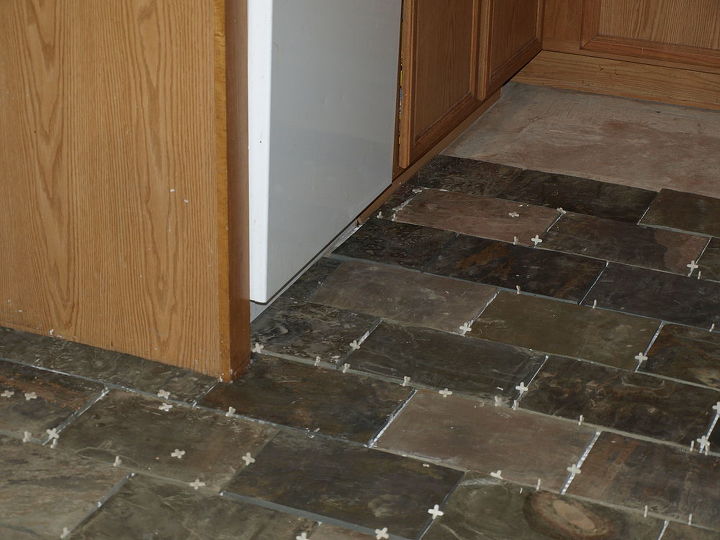 kitchen floor ceramic tile, He had to use a wet saw for the cuts around the cabinets